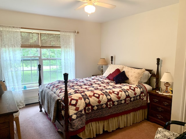 150 Leach Point Rd, Perry, ME 04667 - bedroom with carpet floors, baseboard heating, and a ceiling fan