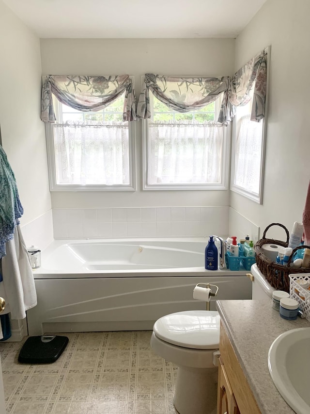 150 Leach Point Rd, Perry, ME 04667 - bathroom featuring plenty of natural light, a garden tub, and vanity