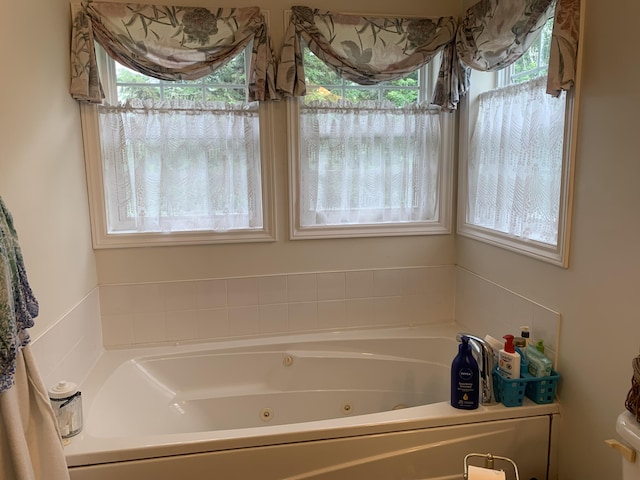 150 Leach Point Rd, Perry, ME 04667 - bathroom with plenty of natural light and a tub with jets