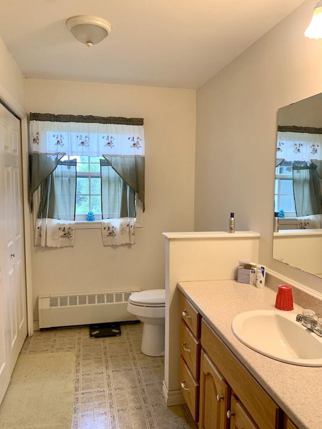 150 Leach Point Rd, Perry, ME 04667 - bathroom with radiator heating unit and vanity