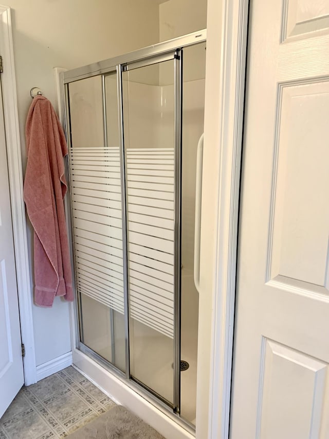 150 Leach Point Rd, Perry, ME 04667 - bathroom with a stall shower