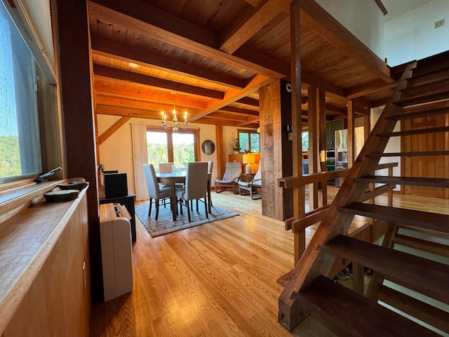 911 Orion Point Way, Harpswell, ME 04079 - dining room with a wooden ceiling with exposed beams, light wood-type flooring, a chandelier, and stairway