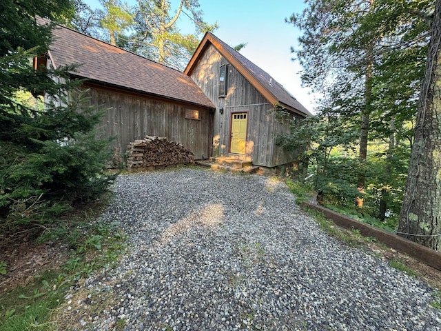 911 Orion Point Way, Harpswell, ME 04079 - rustic home with a shingled roof and driveway