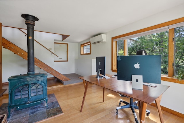 911 Orion Point Way, Harpswell, ME 04079 - office area featuring an AC wall unit, healthy amount of natural light, and wood finished floors