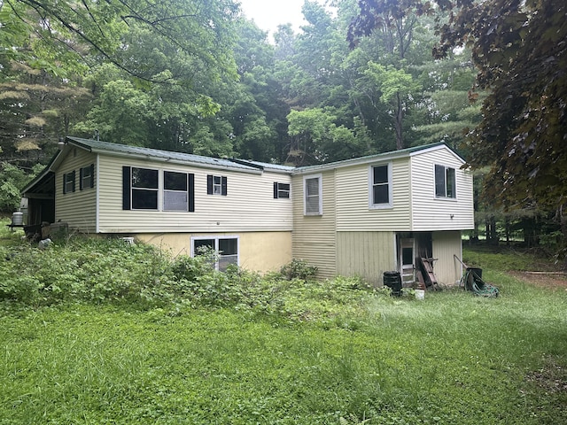 489 Lovejoy Pond Rd, Fayette, ME 04349 - rear view of property featuring a metal roof