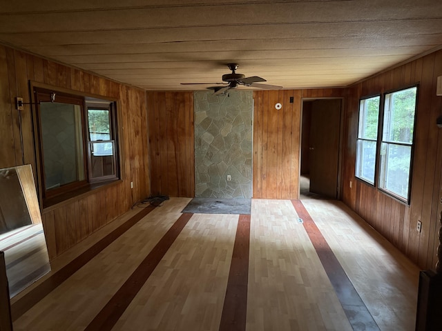 489 Lovejoy Pond Rd, Fayette, ME 04349 - empty room with wood walls, wood finished floors, and a ceiling fan
