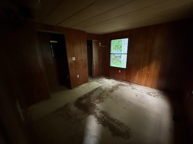 489 Lovejoy Pond Rd, Fayette, ME 04349 - unfurnished bedroom with wood walls and a closet
