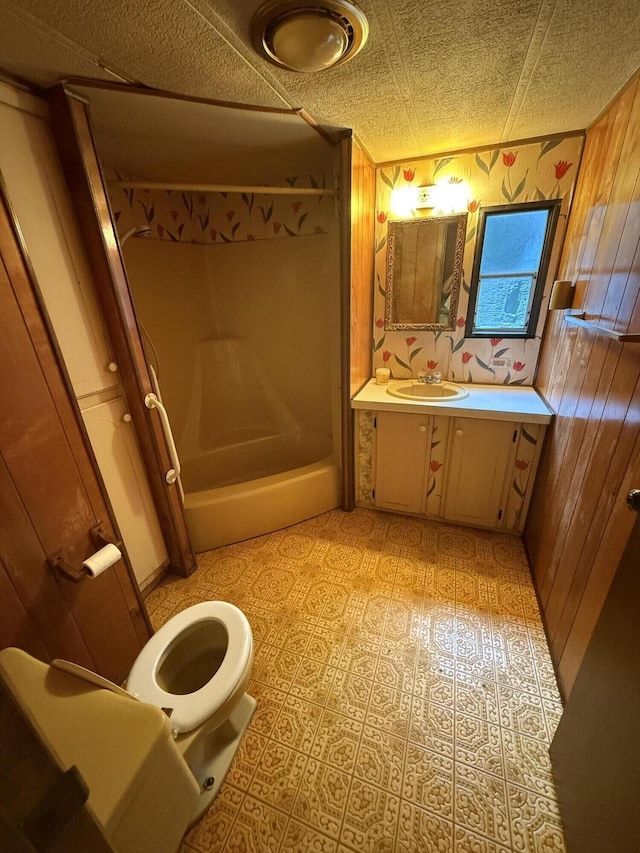 489 Lovejoy Pond Rd, Fayette, ME 04349 - bathroom with vanity, wooden walls, and washtub / shower combination