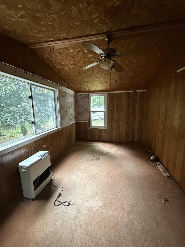 489 Lovejoy Pond Rd, Fayette, ME 04349 - bonus room featuring heating unit, wood walls, a ceiling fan, lofted ceiling, and carpet