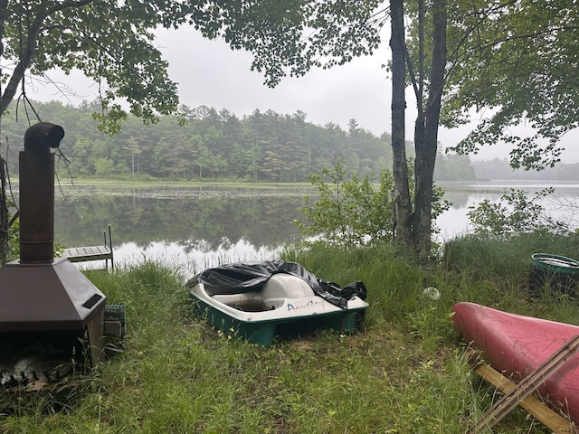 489 Lovejoy Pond Rd, Fayette, ME 04349 - water view featuring a boat dock and a heavily wooded area