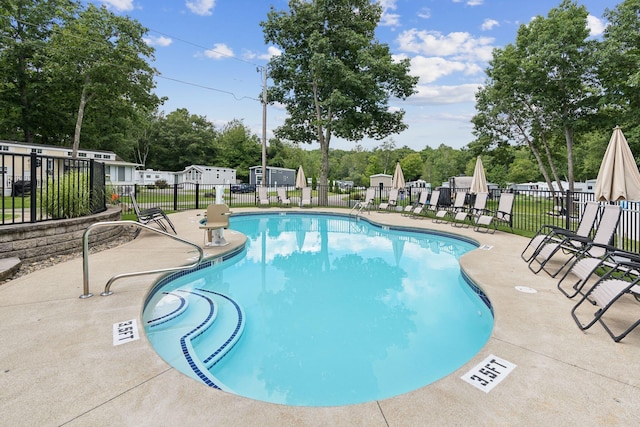 191 Tatnic Rd Unit 74, Wells, ME 04090 - community pool featuring a patio and view of scattered trees