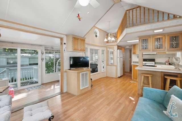 191 Tatnic Rd Unit 74, Wells, ME 04090 - living room featuring light wood-style flooring, high vaulted ceiling, a chandelier, and ceiling fan