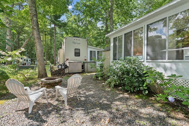191 Tatnic Rd Unit 74, Wells, ME 04090 - view of yard featuring an outdoor fire pit