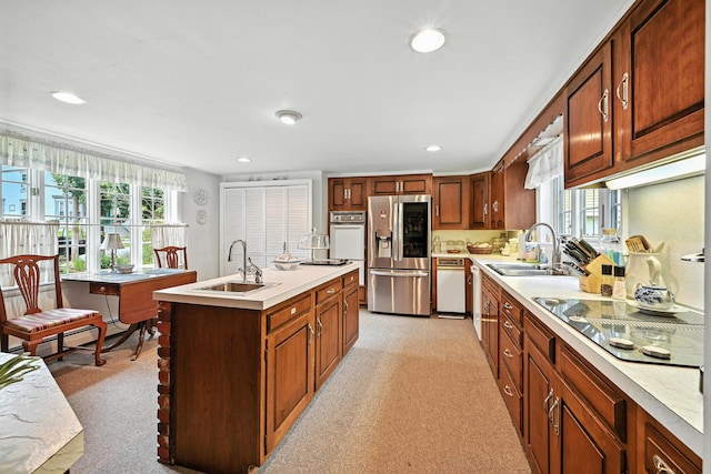 43 Green St, Augusta, ME 04330 - kitchen with stainless steel refrigerator with ice dispenser, oven, black electric cooktop, plenty of natural light, and recessed lighting