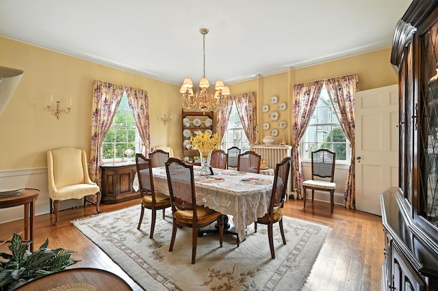 43 Green St, Augusta, ME 04330 - dining room with a chandelier, healthy amount of natural light, light wood-style flooring, and ornamental molding