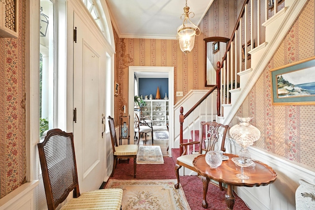 43 Green St, Augusta, ME 04330 - foyer with wallpapered walls, stairway, and crown molding