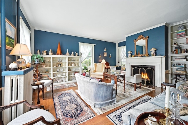 43 Green St, Augusta, ME 04330 - living room featuring ornamental molding, a fireplace with flush hearth, and wood finished floors