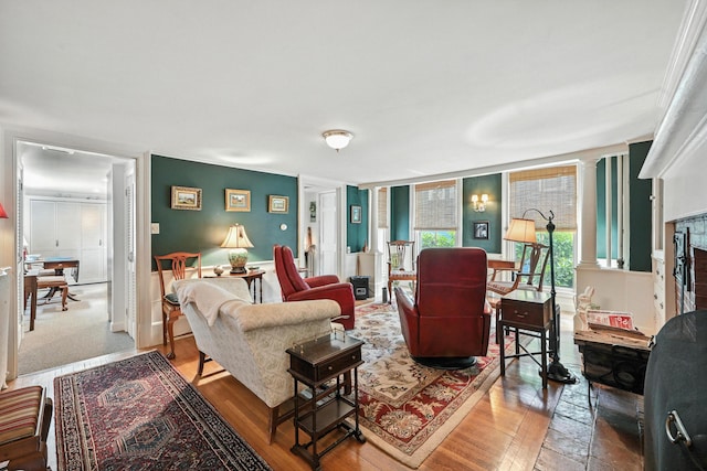 43 Green St, Augusta, ME 04330 - living room with decorative columns, wood finished floors, and a fireplace