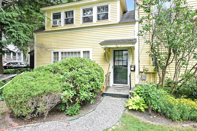 43 Green St, Augusta, ME 04330 - view of front of house featuring a shingled roof and cooling unit