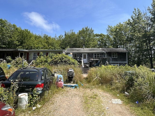 957 Tunk Lake Rd, Sullivan, ME 04664 - view of front of house with a wooden deck