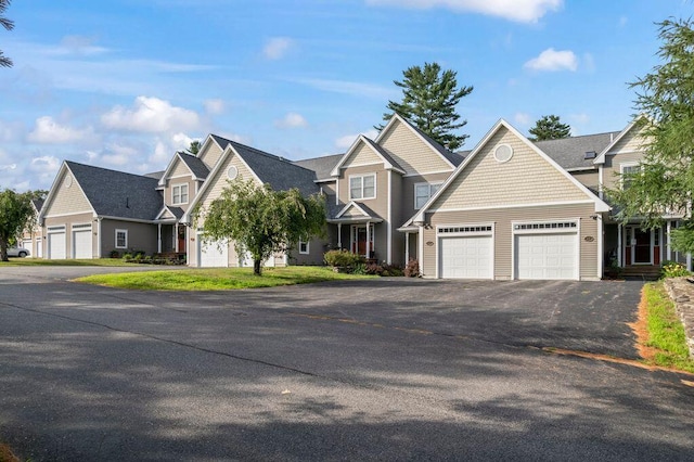 38 Harvest Hill Ln Unit 38, Auburn, ME 04210 - view of front of property featuring driveway, a garage, and a residential view