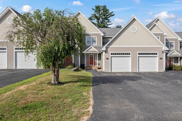 38 Harvest Hill Ln Unit 38, Auburn, ME 04210 - view of front facade with driveway, a front yard, and a garage