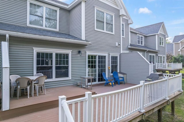 38 Harvest Hill Ln Unit 38, Auburn, ME 04210 - wooden deck with outdoor dining space