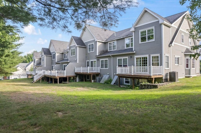 38 Harvest Hill Ln Unit 38, Auburn, ME 04210 - back of property with a deck, a yard, a residential view, and roof with shingles