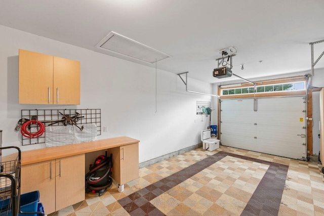 38 Harvest Hill Ln Unit 38, Auburn, ME 04210 - garage with a garage door opener and baseboards