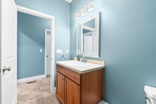 38 Harvest Hill Ln Unit 38, Auburn, ME 04210 - bathroom with vanity and toilet
