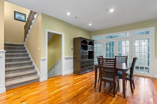 38 Harvest Hill Ln Unit 38, Auburn, ME 04210 - dining area featuring wood finished floors, stairs, wainscoting, a decorative wall, and recessed lighting