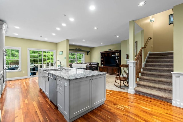 38 Harvest Hill Ln Unit 38, Auburn, ME 04210 - kitchen featuring stainless steel dishwasher, light wood-style floors, gray cabinets, a kitchen island with sink, and recessed lighting
