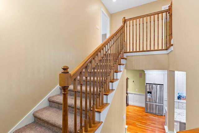 38 Harvest Hill Ln Unit 38, Auburn, ME 04210 - stairway with wood finished floors and recessed lighting