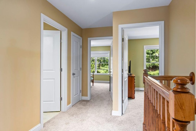 38 Harvest Hill Ln Unit 38, Auburn, ME 04210 - corridor featuring light carpet, healthy amount of natural light, and an upstairs landing