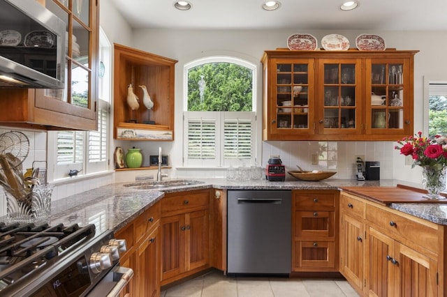 1 Grimes Ave, Boothbay, ME 04544 - kitchen featuring stainless steel appliances, brown cabinetry, healthy amount of natural light, stone counters, and recessed lighting