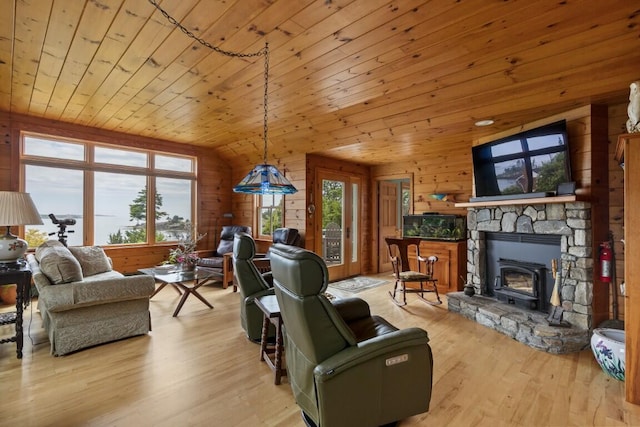 1 Grimes Ave, Boothbay, ME 04544 - living area featuring healthy amount of natural light, wooden walls, wood finished floors, wood ceiling, and lofted ceiling