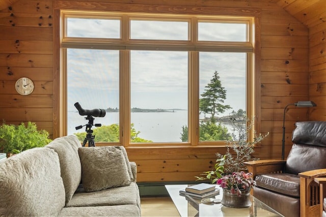 1 Grimes Ave, Boothbay, ME 04544 - living room with wooden walls, lofted ceiling, plenty of natural light, a water view, and wood finished floors