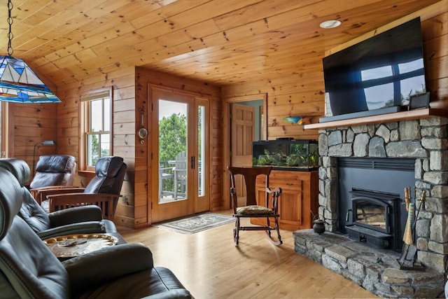 1 Grimes Ave, Boothbay, ME 04544 - living area featuring wood ceiling, light wood-type flooring, wood walls, lofted ceiling, and a wood stove