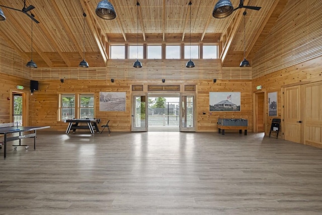 1 Grimes Ave, Boothbay, ME 04544 - living room featuring high vaulted ceiling, wooden walls, wood finished floors, a wood ceiling with exposed beams, and a ceiling fan