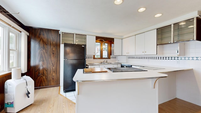 307 Russell St, Lewiston, ME 04240 - kitchen featuring black appliances, light countertops, tasteful backsplash, glass insert cabinets, and recessed lighting