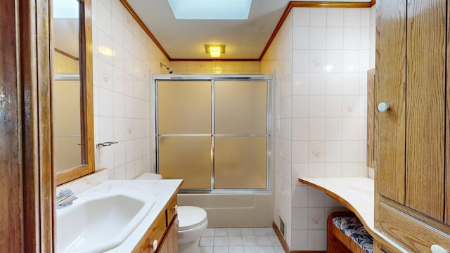 307 Russell St, Lewiston, ME 04240 - full bathroom with tile walls, vanity, tile patterned flooring, shower / bath combination with glass door, and ornamental molding