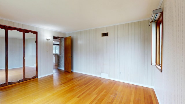 307 Russell St, Lewiston, ME 04240 - empty room featuring wood finished floors and ornamental molding
