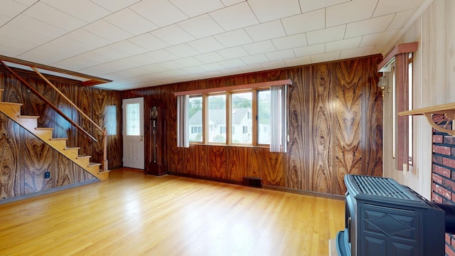 307 Russell St, Lewiston, ME 04240 - foyer entrance with wooden walls, wood finished floors, healthy amount of natural light, and stairway
