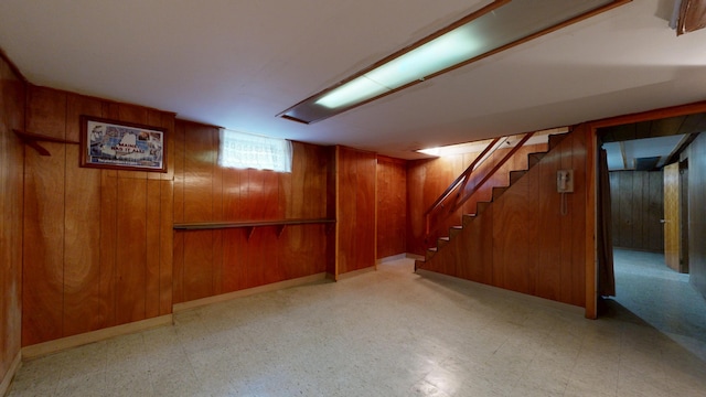 307 Russell St, Lewiston, ME 04240 - below grade area featuring wooden walls, tile patterned floors, and stairs