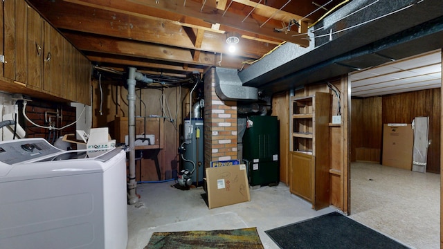 307 Russell St, Lewiston, ME 04240 - unfinished basement featuring independent washer and dryer, water heater, and wood walls