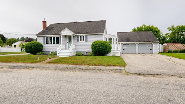 307 Russell St, Lewiston, ME 04240 - cape cod-style house with a garage, a chimney, roof with shingles, and driveway