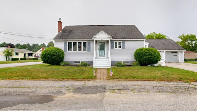 307 Russell St, Lewiston, ME 04240 - view of front facade featuring a chimney, a front yard, a shingled roof, and concrete driveway
