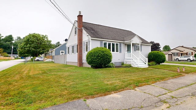 307 Russell St, Lewiston, ME 04240 - view of front of house featuring a chimney and roof with shingles