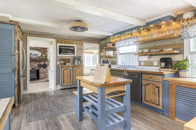 14 Bailey Ln, Brunswick, ME 04011 - kitchen with open shelves, stainless steel appliances, beamed ceiling, light wood-style floors, and a textured ceiling