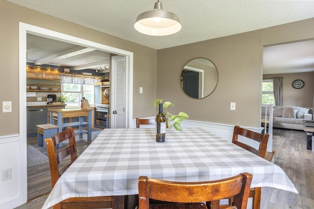 14 Bailey Ln, Brunswick, ME 04011 - dining area with a textured ceiling, wood finished floors, and a wainscoted wall